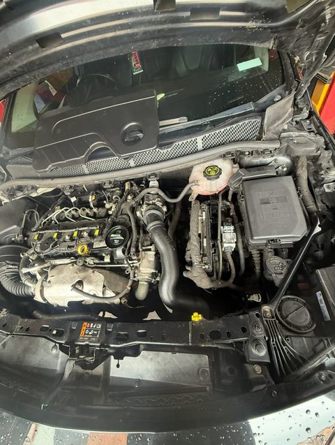 Clean, reassembled engine bay with the bonnet up, at AGR Performance, Stafford
