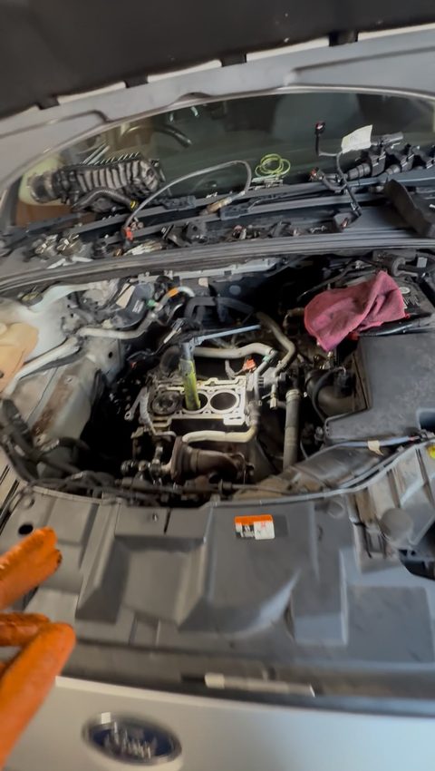 Ford with the bonnet up and the engine's top end stripped down, cylinder bores visible, at AGR Performance, Stafford